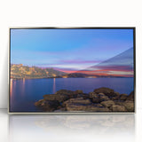 Mid-century modernist art depicting Portofino, Italy, in vibrant colors on a silver-framed acrylic.