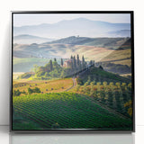 Large abstract wall art depicting a Tuscan landscape in muted earth tones on framed acrylic.