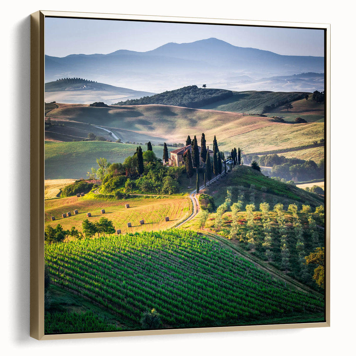 Landscape painting of Tuscany on framed canvas, featuring silver and gold tones, ideal for bedroom wall art.