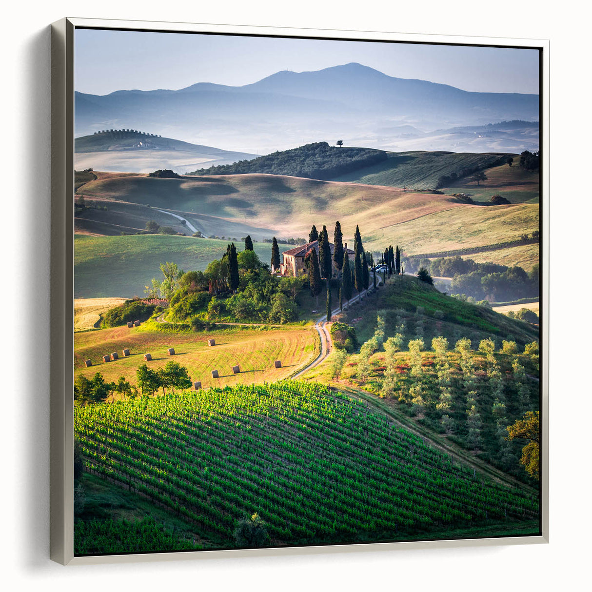 Framed canvas landscape art painting featuring the rolling hills of Tuscany in muted earth tones.