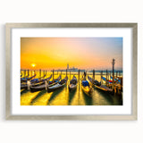 Extra large abstract art print of Venice scenery in muted blue and gray hues on a silver-framed canvas.