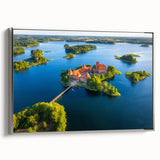 Framed canvas depicting a vintage European landscape with colorful elements on a black background.