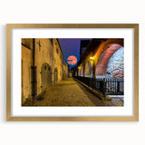 Abstract art print of Amsterdam canal in muted blue and gray tones on a gold-framed canvas, suitable for dining room decor.