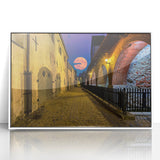 Mid-century modernist art of Amsterdam canals in muted gray and blue, acrylic print framed in white.