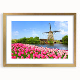 Abstract art print of a European scenery in muted earth tones, framed in gold, suitable for bedroom or dining room decor.