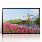 Large abstract wall art featuring a mid-century modernist depiction of a European scenery in muted earth tones on a framed…