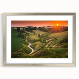 Extra large abstract art print of a textured European scenery in muted earth tones, framed in silver.