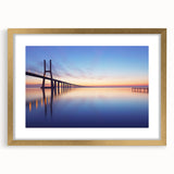 Abstract art print of Lisbon scenery in muted gold and blue tones, framed with a gold mat, ideal for dining room decor.