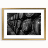 Abstract art print of Porto's riverside scene in muted blue and gold tones, framed with a gold matte.