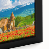 Close-up of a textured black wall art depicting a colorful European scenery on a framed canvas, ideal for living room decor.