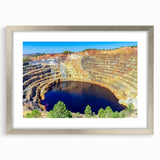 Abstract art print of Andalucian landscape in muted earth tones, framed in silver, suitable for dining room decor.