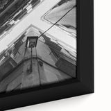 Black framed canvas featuring a textured, colorful depiction of Barcelona's architecture, ideal for living room decor.