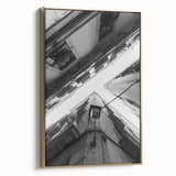 Framed canvas depicting a vintage-style Barcelona landscape in muted gold and black tones, ideal for bedroom wall art.