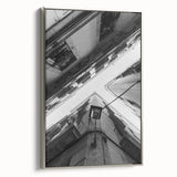 Framed canvas depicting colorful Barcelona landscape in vintage poster style, ideal for living room decor.