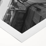 Art deco poster of Barcelona skyline in muted gray and blue tones on a rolled canvas, ideal for dining room wall art.