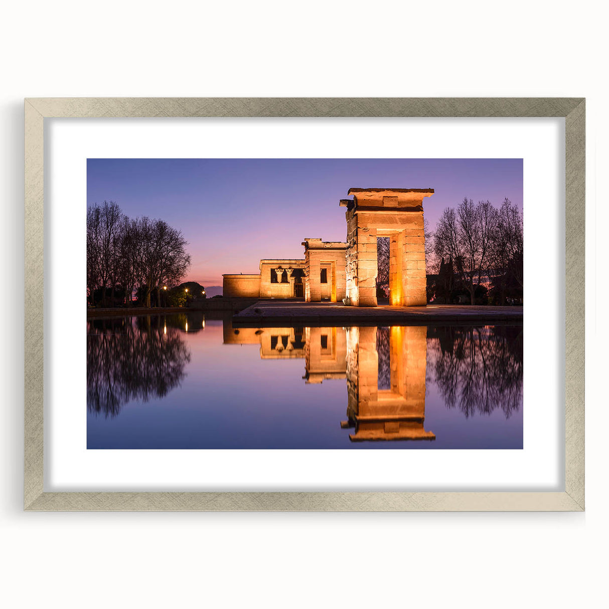 Textured abstract art print of Madrid scenery in muted earth tones, framed in silver, suitable for bedroom decor.