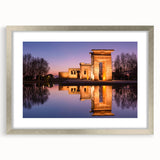 Textured abstract art print of Madrid scenery in muted earth tones, framed in silver, suitable for bedroom decor.