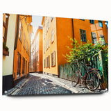 Acrylic print of Stockholm with muted blue and yellow tones, ideal for dining room decor.