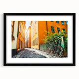 Abstract art print of Stockholm in vibrant colors on a large textured canvas, framed in black, ideal for living room decor.