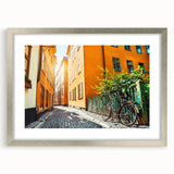 Textured abstract art print of Stockholm scenery in muted colors on a framed silver mat, suitable for bedroom decor.