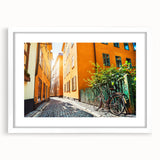 Abstract art print of Stockholm skyline in muted blue and gray tones on a white framed mat, ideal for dining room decor.