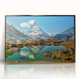 Large art print of a Swiss landscape in muted green and blue, framed in acrylic with a mid-century modernist style.