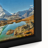 Extra large framed canvas featuring a textured depiction of a Swiss landscape in black with vibrant, colorful accents.