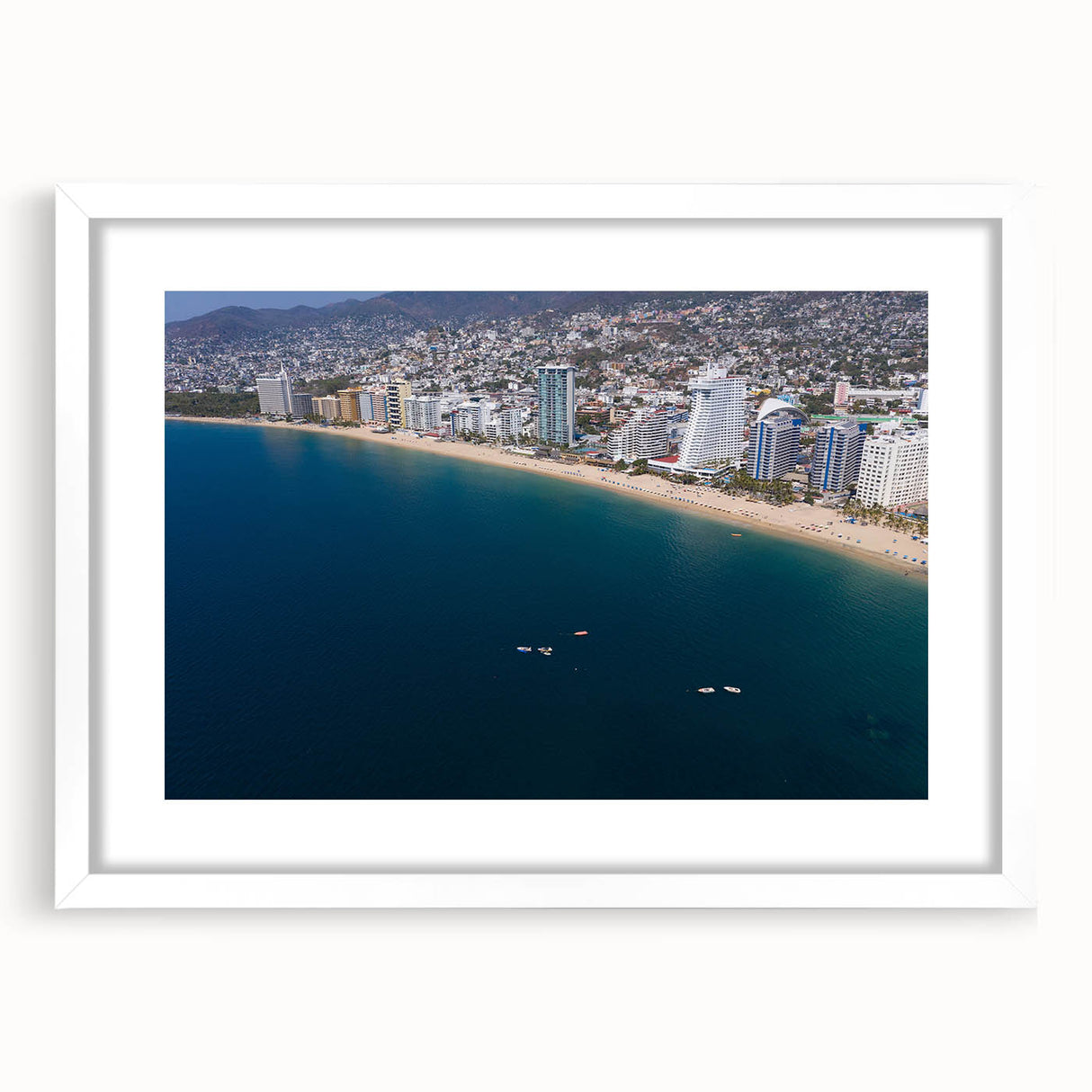 Abstract art print of Acapulco scenery in a white frame with mat, using vibrant blue and green tones.
