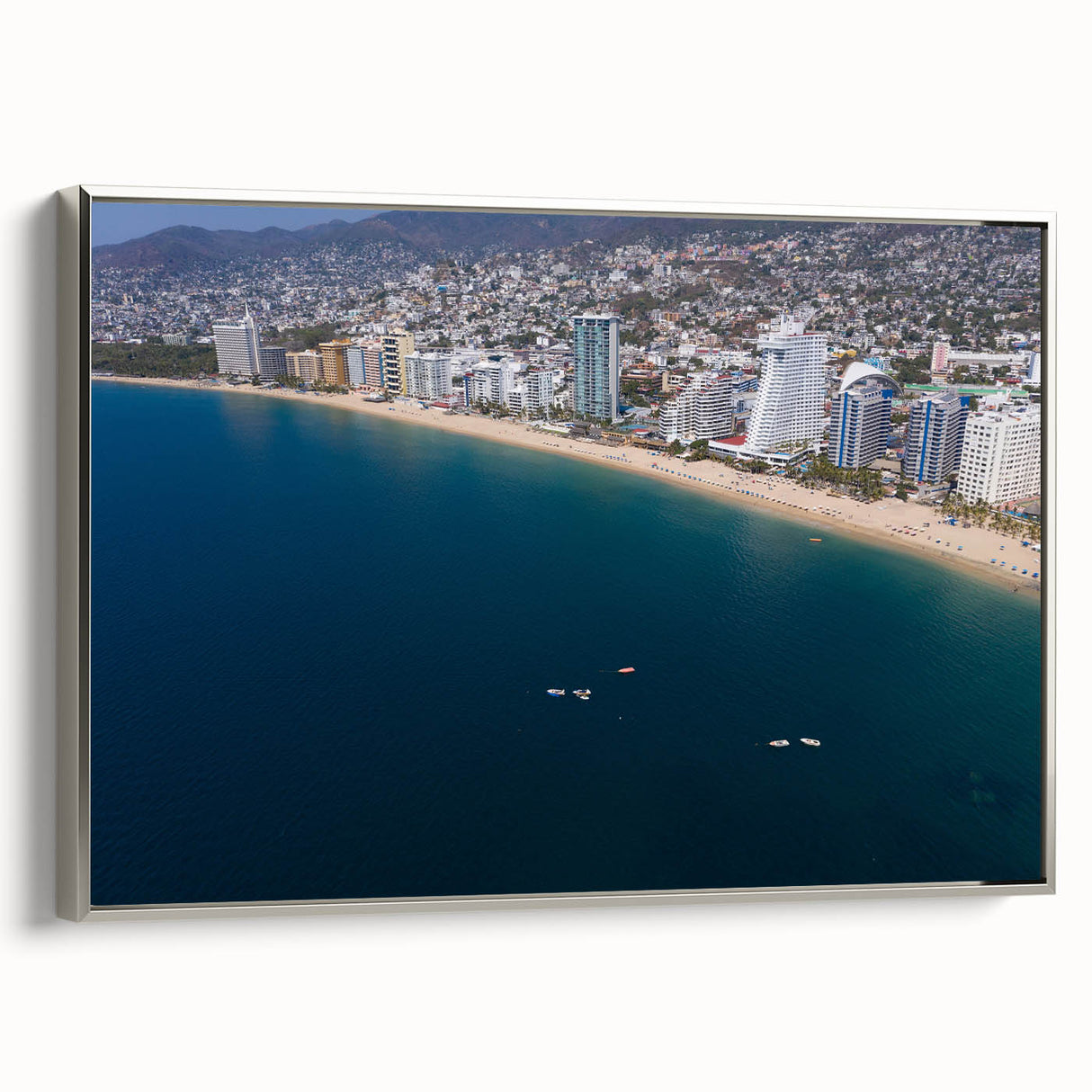 Framed canvas of vintage Acapulco landscape with colorful art and black accents, ideal for living room decor.