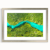 Textured abstract art print depicting Quintana Roo scenery in a silver frame, suitable for bedroom decor.