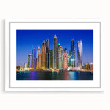 Abstract art print of Dubai skyline in muted gray and blue tones on a framed white mat.