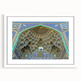Abstract art print of a Middle Eastern scenery in muted earth tones on a white matted frame, suitable for dining room decor.
