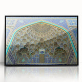 Large abstract wall art of a Middle Eastern scenery in muted earth tones, framed in black acrylic.