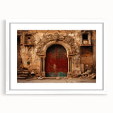 Abstract art print of a Middle Eastern desert scene in muted orange and brown tones, framed with a white mat.