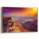 Framed canvas wall art depicting a vintage-style landscape of a Middle Eastern scene in muted gold and black tones.