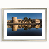 Textured abstract art print of Oman scenery in muted earth tones, framed with a silver mat, suitable for bedroom wall decor.