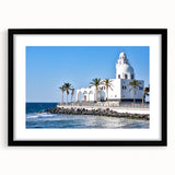 Abstract art print of a colorful, textured Middle Eastern landscape on a large black-framed canvas.