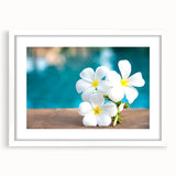 Abstract art print of Bora Bora scenery in muted blue and green tones on a white-framed canvas.