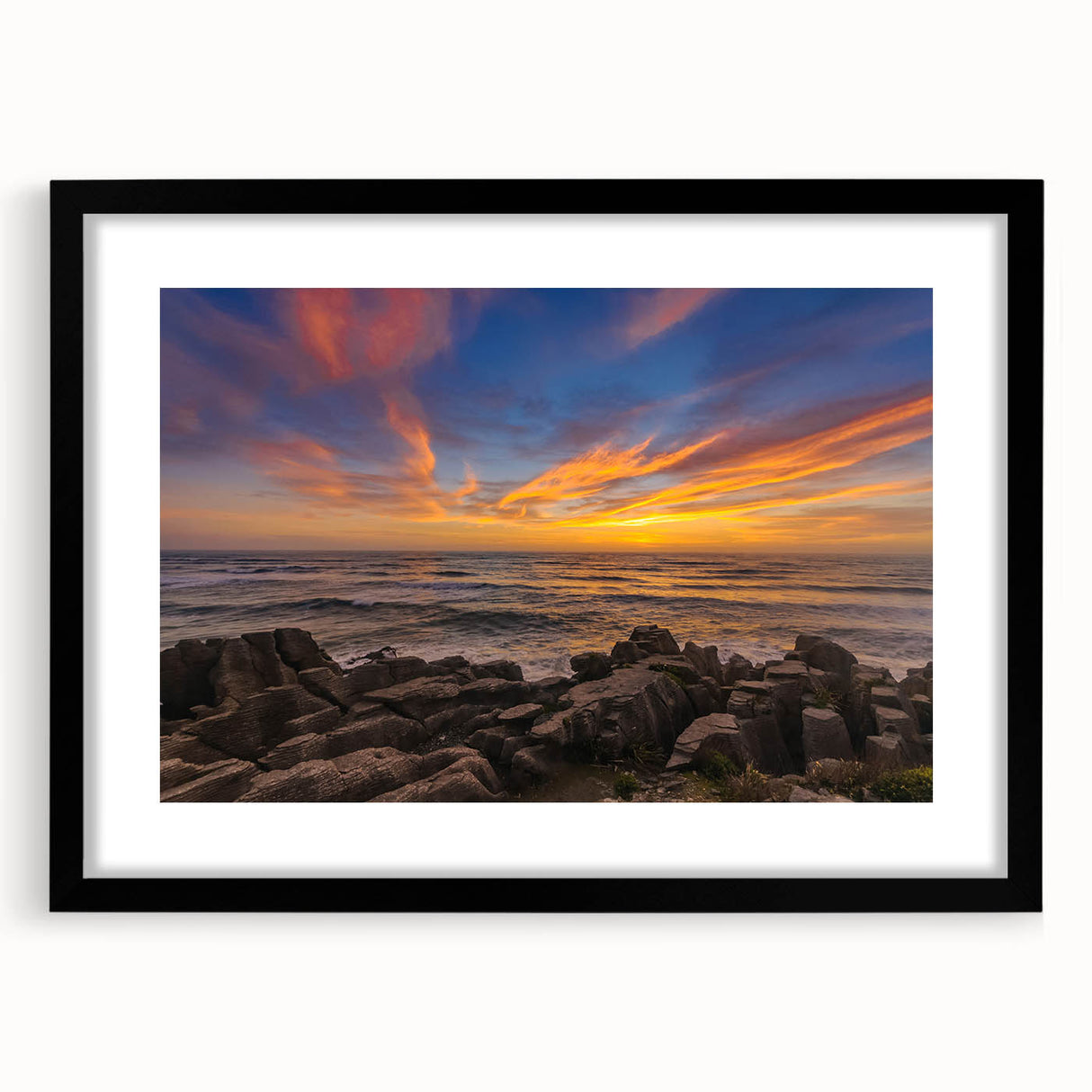 Extra large abstract art print depicting a colorful, textured New Zealand West Coast scenery on a black-framed canvas.