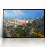 Large abstract wall art depicting a stylized Buenos Aires cityscape in muted gray and blue tones, framed in black acrylic.