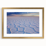 Abstract art print of a Bolivian landscape in textured gold frame, with earthy and blue tones, ideal for living room decor.