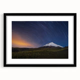 Colorful abstract art print of a Galapagos landscape on a large textured canvas, framed in black.