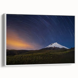 Vintage poster art of Galapagos scenery on framed canvas, featuring colorful art with black accents.