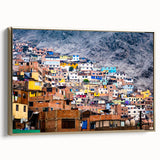 Framed canvas of a vintage-style landscape painting featuring the Peruvian scenery in muted gold and black tones.