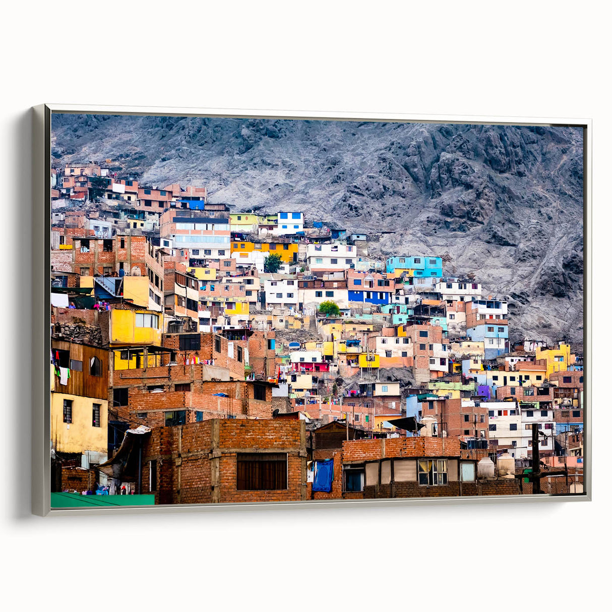 Framed canvas depicting a vintage-style landscape of a Peruvian scene with colorful art and black borders.