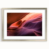 Textured art depicting Arizona's Antelope Canyon in muted earth tones on a framed silver mat, suitable for bedroom decor.