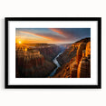 Colorful abstract art print of the Grand Canyon in vibrant hues on a large framed canvas, suitable for living room decor.