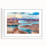 Abstract art print of Lake Powell with muted blue and orange tones on a framed white mat.