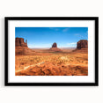 Extra large framed wall art of abstract Monument Valley in vibrant, textured colors, suitable for living room decor.