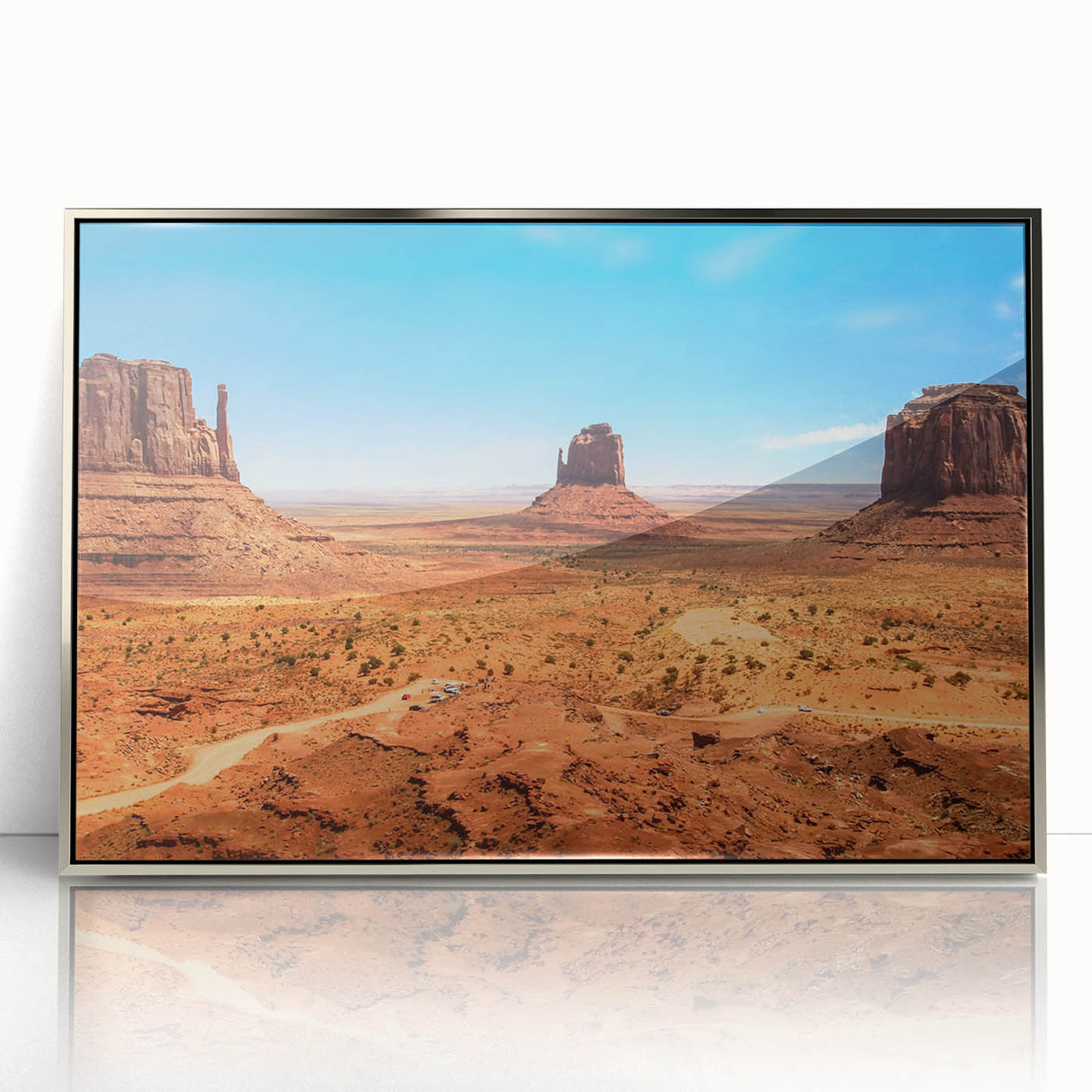Mid-century modernist art depicting Monument Valley in muted earth tones on a framed acrylic print.